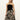 A person with long blonde hair models Sanctuary Clothing's "meet me at sea" midi dress in black mirage, set against a plain white background.