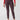 A person wearing Sanctuary Clothing's Runway Legging in Mars Red Check ankle-length pants paired with a bright red long-sleeve top and black flats, standing against a plain white background.