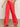 A person is standing barefoot on a concrete floor, wearing Sanctuary Clothing's highland wide leg standard rise pant in cayenne and a patterned top, with one hand in a pocket and their face not visible.
