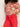 A person is wearing a beige and red abstract floral shirt with Sanctuary Clothing's highland wide leg standard rise pant in cayenne. They stand against a plain white background, with their face not visible.