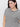 A person with long dark hair, wearing Sanctuary Clothing's "Perfect Textured Tee in Macrame Black Stripe" is looking at the camera with a slight smile against a plain white background, accessorized with gold hoop earrings.