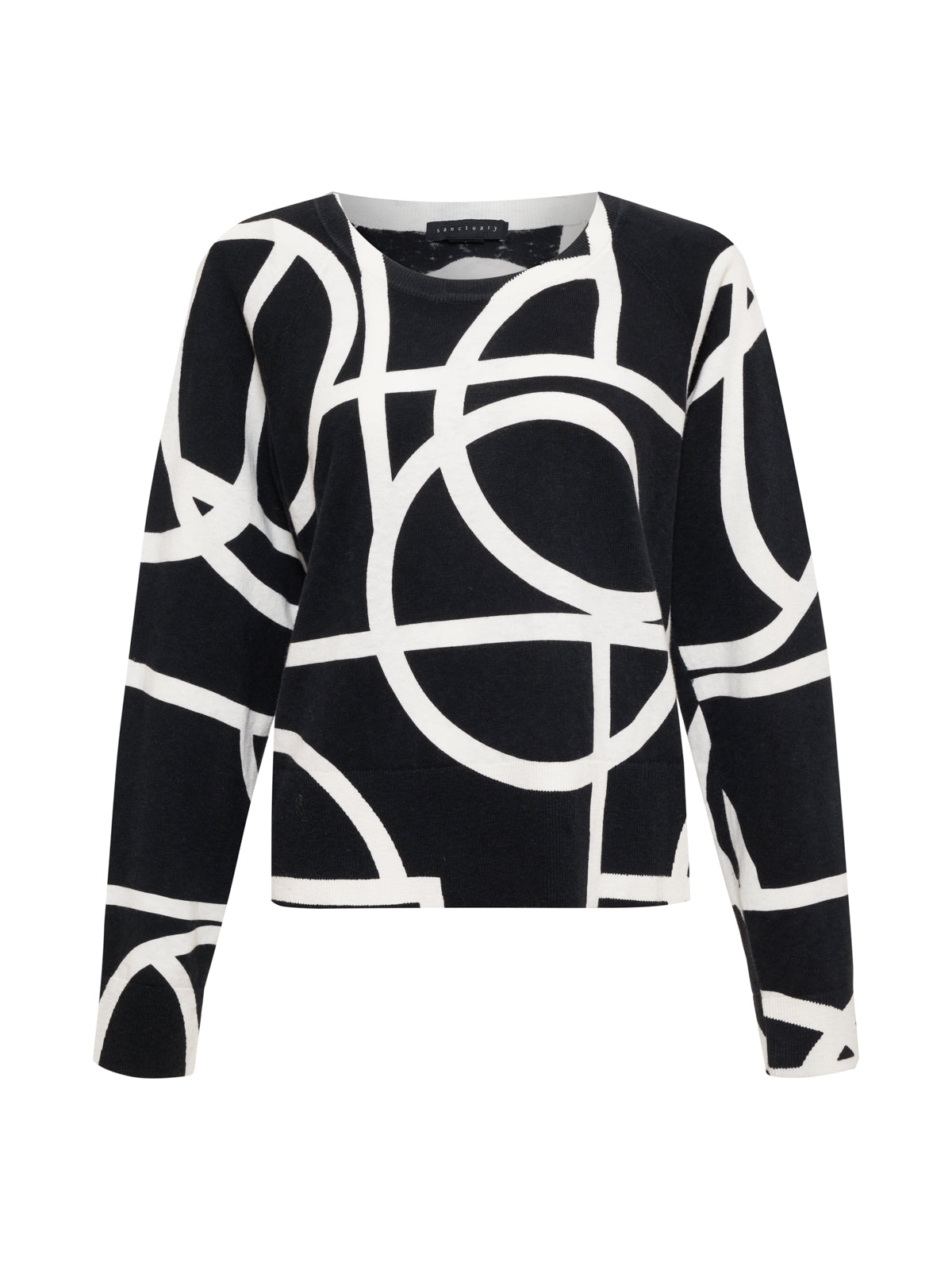 The All Day Long Sweater Graphic Lines Black by Sanctuary Clothing features a black long-sleeve design with an abstract white geometric pattern of intersecting lines and curves, creating a modern, artistic look. It has a crew neckline.