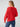 From behind, a person with long hair is shown wearing the Sanctuary Clothing "Falling For Fall Cardi Cherry Red," a bright red, textured knit sweater. Paired with fitted, dark blue jeans, the individual stands against a plain and light-colored background.