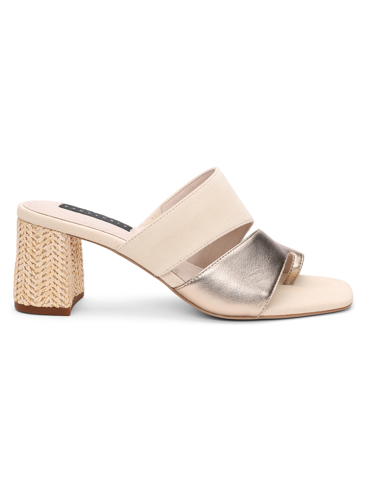 Introducing the Brisk Sandal Nude Bronze Sand Dollar from Sanctuary Clothing. This stylish, open-toe block heel sandal features a cream-colored upper with two wide straps—one in metallic gold and the other in cream. The medium-height heel boasts a woven, natural texture, while the footbed comes in a light beige hue.