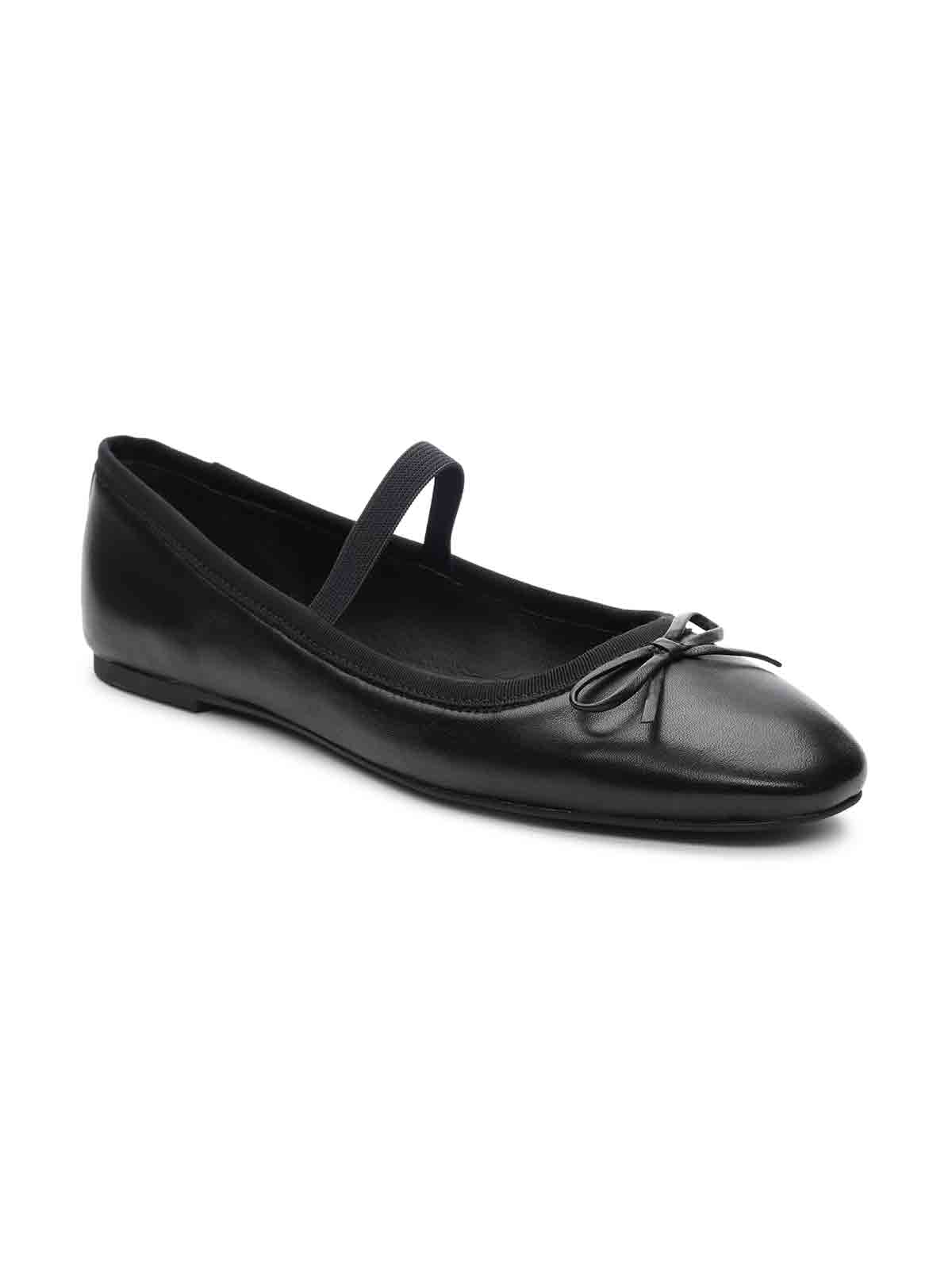 The Facile Ballet Flat Black by Sanctuary Clothing features a small bow on the toe and an elastic strap across the instep. The shoe has a rounded toe and boasts a simple, elegant design.