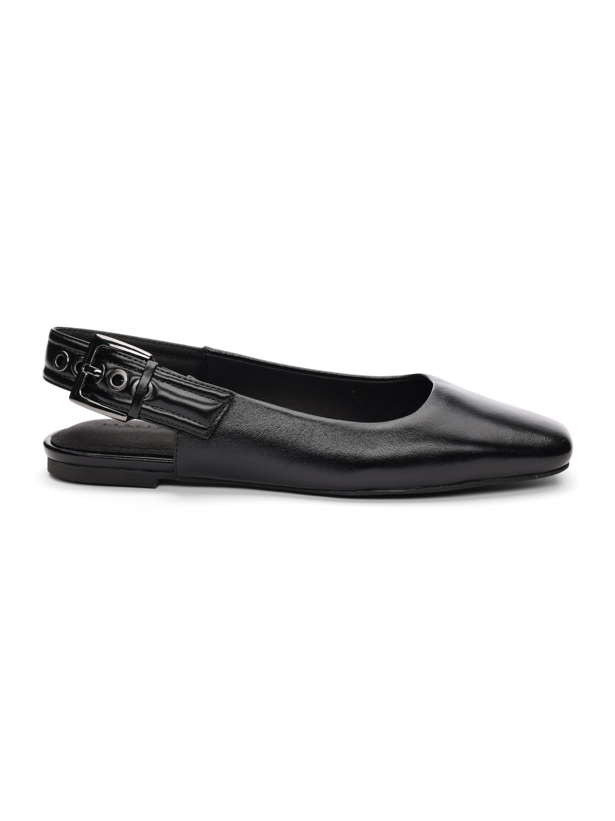 The Kitchy Slingback Flat Black by Sanctuary Clothing is a sleek and elegant black slingback flat shoe featuring a rounded toe and a low heel. It has an adjustable strap with a small buckle at the back for a secure fit, and its smooth, polished material enhances its sophisticated appearance.