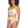 A woman with curly hair wears the Sanctuary Clothing Daytripper One Shoulder Bikini Top Multi, which features cutout details and a high-waisted bottom. The swimsuit boasts a vibrant, abstract pattern in shades of green, yellow, purple, and pink. She stands against a plain white background.