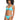 A person with curly hair is smiling while modeling the Sandbar Solids Hipster Bikini Bottom in Curacao from Sanctuary Clothing. The light blue swimsuit features a knotted detail on the top and matching bikini bottoms. The individual stands in a relaxed pose against a plain white background.