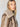 A person with long blonde hair is wearing the Zarina Shearling Coat in Mink Beige by Sanctuary Clothing. They are looking directly at the camera against a plain background.